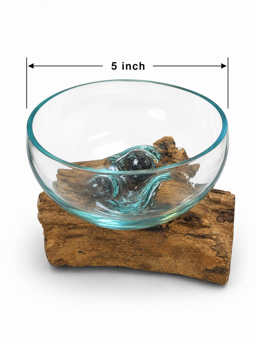 Hand blown glass bowl on driftwood