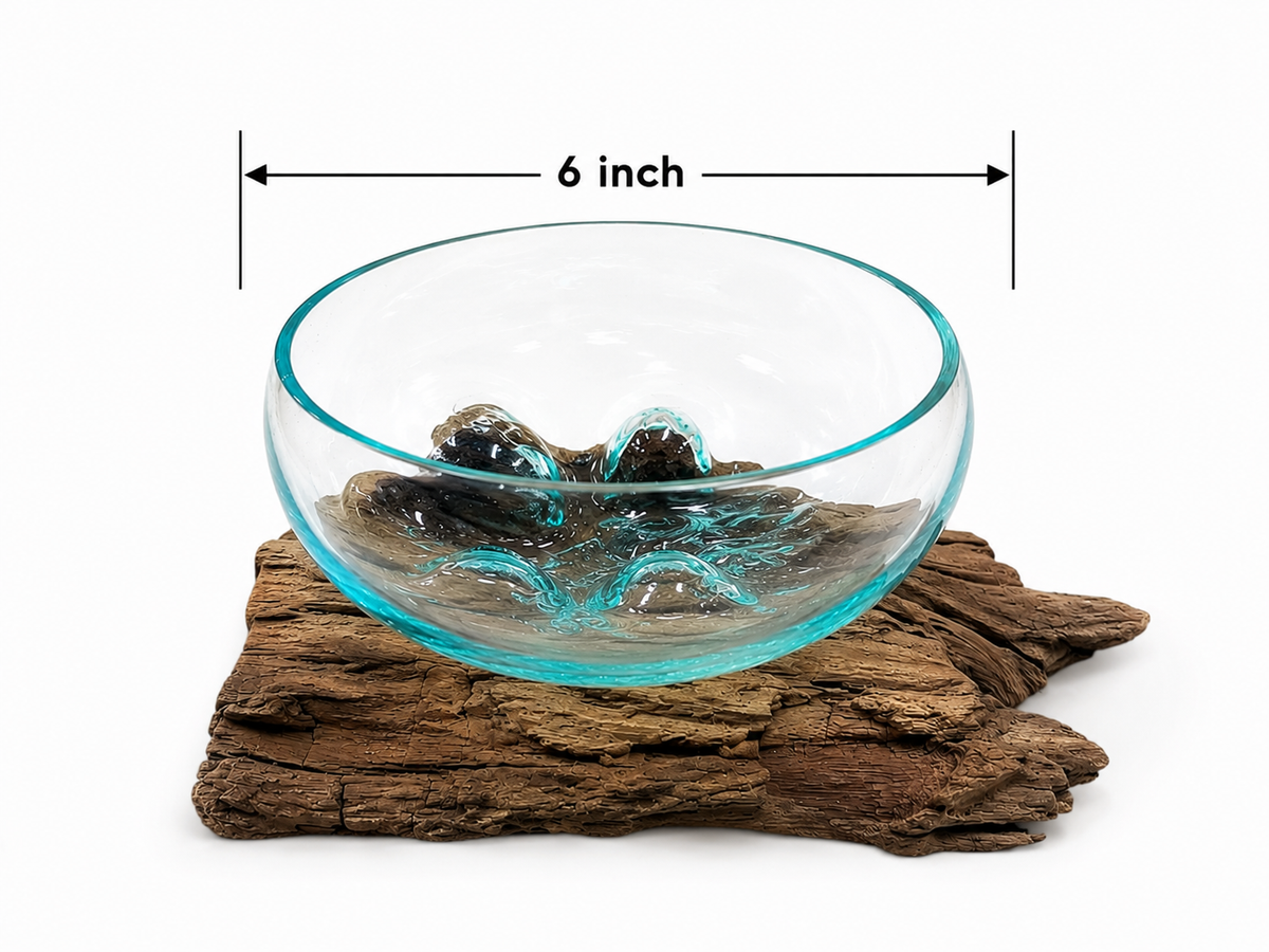 Hand blown glass bowl on driftwood