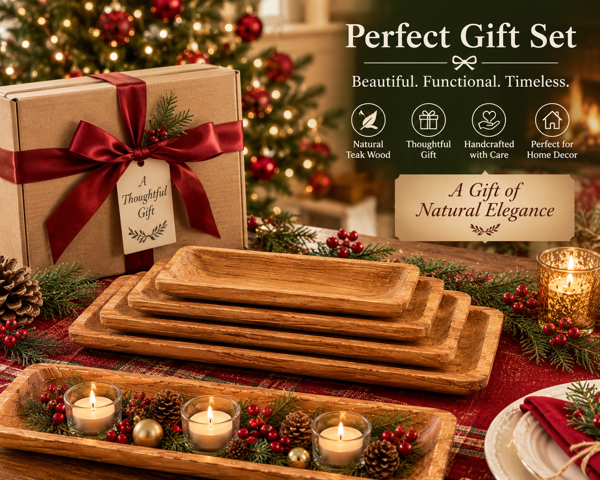 A holiday-themed gift set featuring a stack of rectangular natural wood serving trays, a kraft paper gift box tied with a red ribbon, candles, pinecones, and evergreen branches on a red plaid tablecloth, with promotional text overlays.