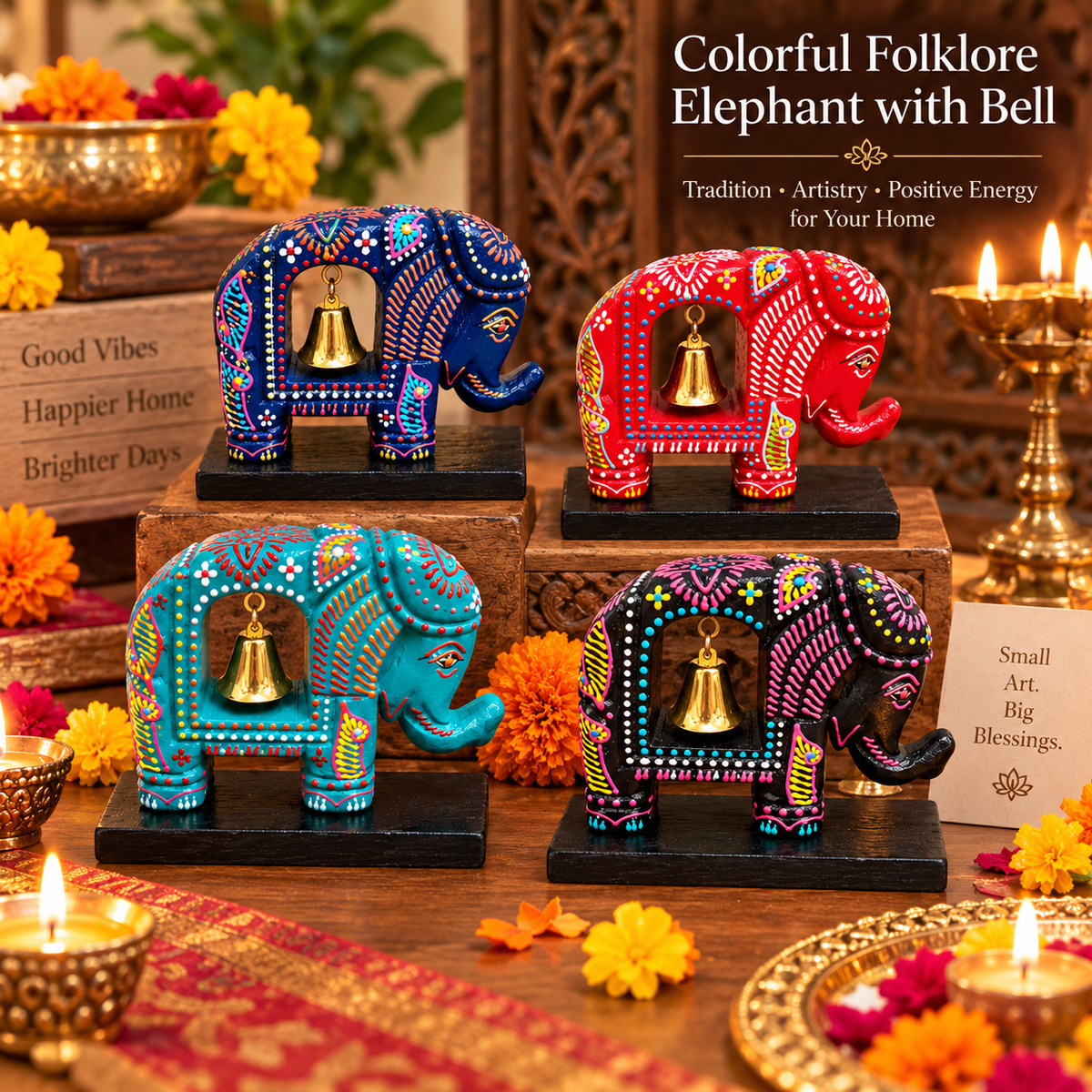 Four hand-painted wooden elephant figurines with hanging gold bells, decorated with intricate folk art patterns in blue, red, teal, and purple, arranged on a wooden table with lit candles and marigolds.