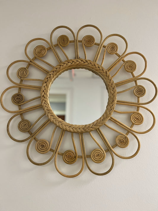 This description aims to convey the boho chic design, handcrafted artistry, versatility, light-reflective beauty, and ease of installation of the rattan wall mirror while evoking a sense of warmth and organic charm.
