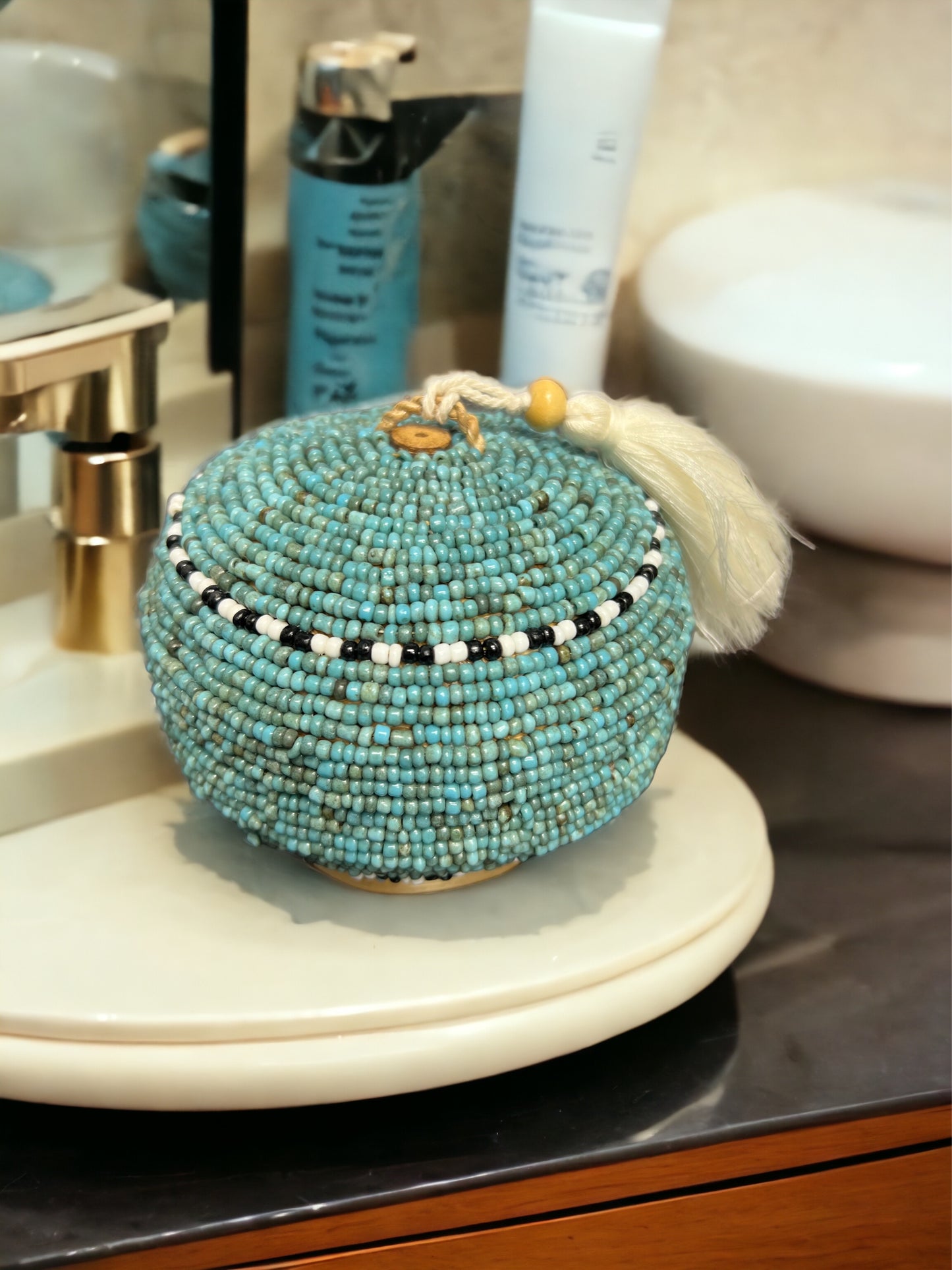 Elevate your jewelry storage with our Beaded Jewelry Box Round. With its handcrafted beauty and practical design, it's the perfect accessory for organizing and displaying your most treasured pieces.