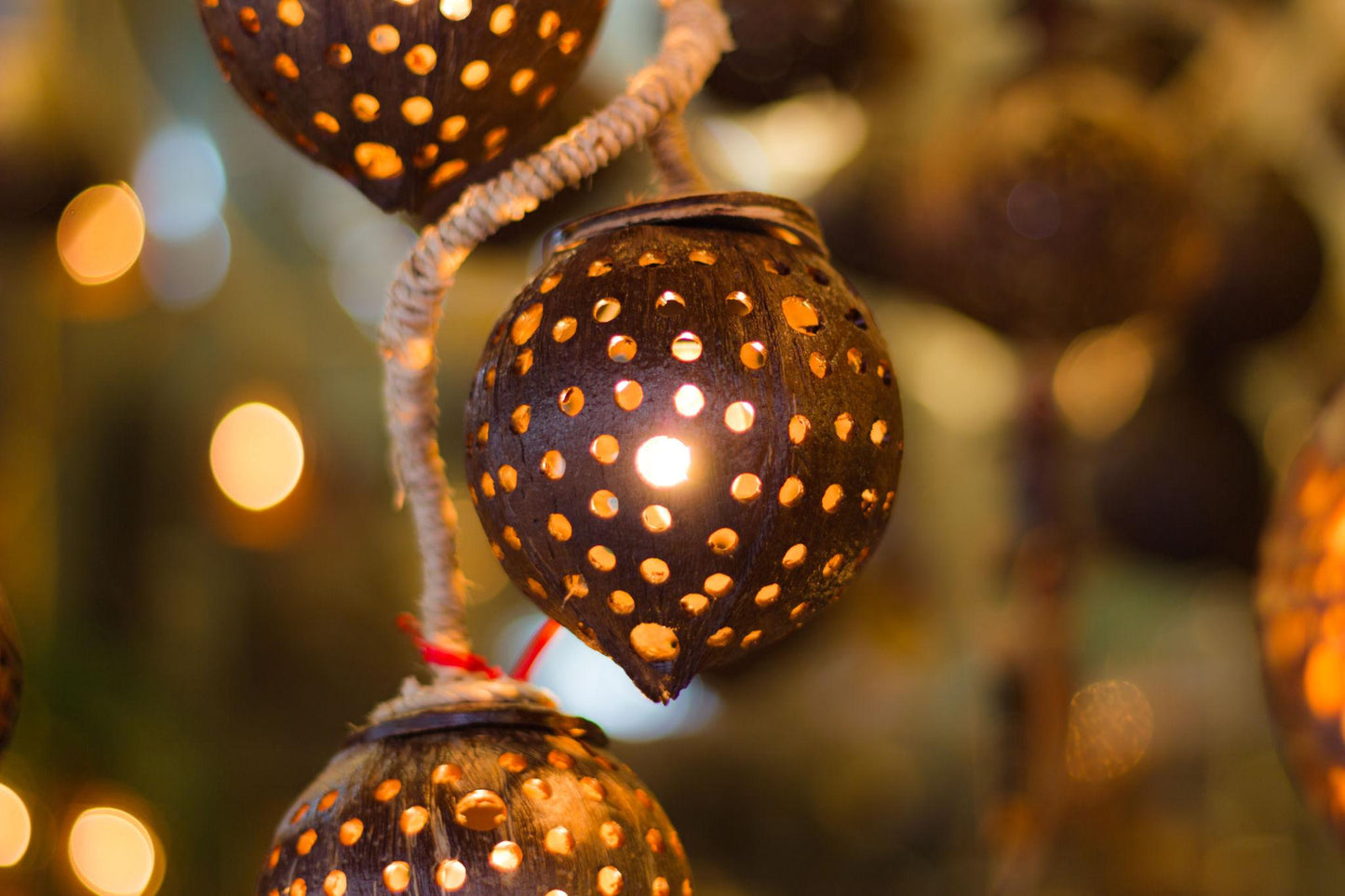 Decorative coco string lights with a bokeh effect in the background