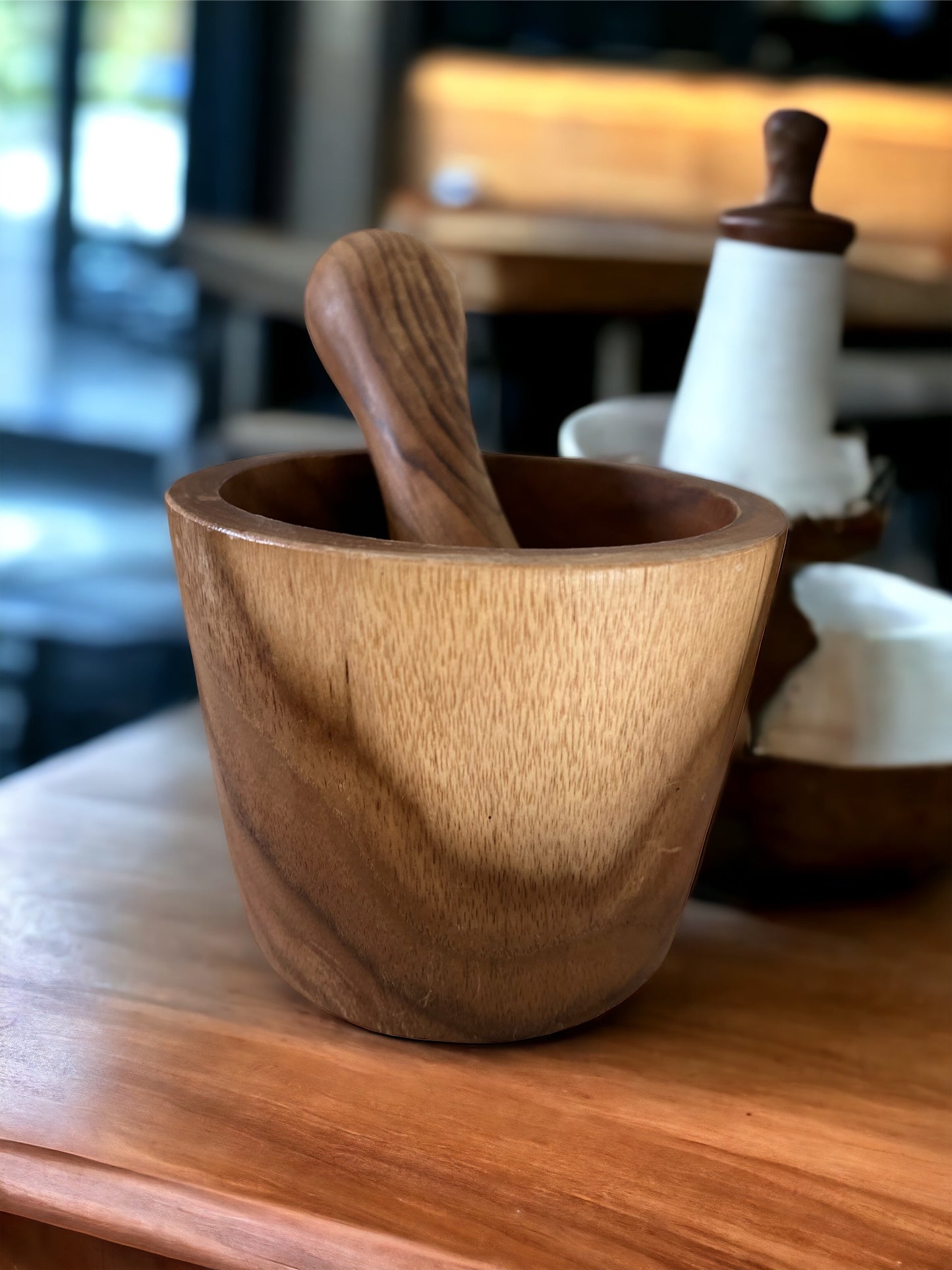  the natural elegance, efficient grinding capabilities, versatile use, easy maintenance, and sustainability of the teak wood mortar and pestle while emphasizing its role as a timeless kitchen essential.