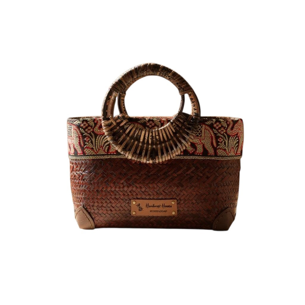 Brown Handwoven straw bag with bamboo handle and silk border detail