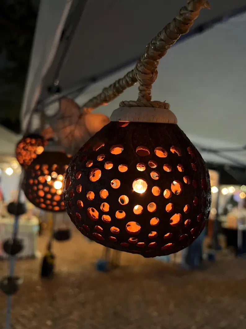 Decorative coco string lights with a textured design on a blurred background