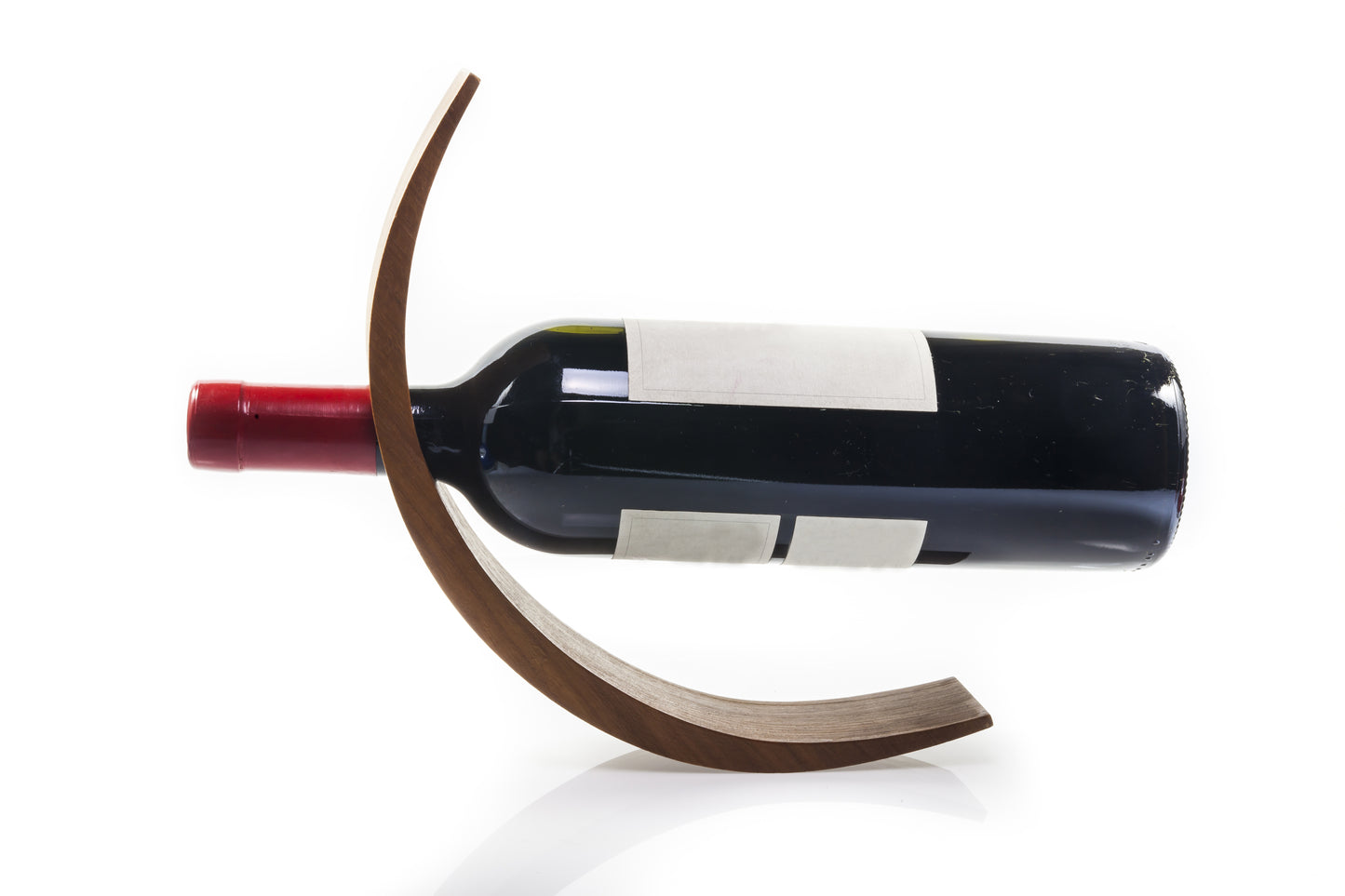 Wine bottle on a unique wooden holder against a white background